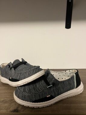 Hey Dude Slip-On Sneakers in Black and White